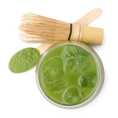 Glass of delicious iced green matcha tea, spoon with powder and bamboo whisk isolated on white, top view