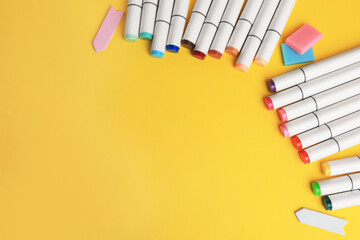 Different school stationery on yellow background, above view with space for text. Back to school