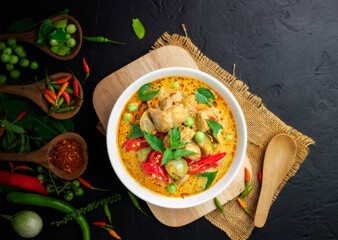 Chicken green curry Asian food, Beef green curry Thai food on a soup bowl with a mixture of herbs, vegetables and Thai red chilli spices. Top view.