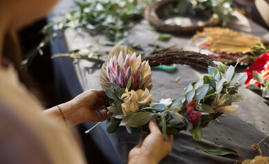 Wreath making workshop and masterclass using festive decorations.