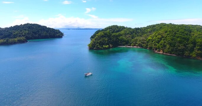 Flying in on a monohull sailboat anchored in a pristine bay next to Afuera Island in Panama
