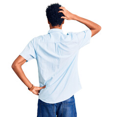 Young african american man wearing casual clothes backwards thinking about doubt with hand on head