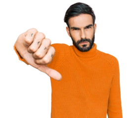 Young hispanic man wearing casual clothes looking unhappy and angry showing rejection and negative with thumbs down gesture. bad expression.