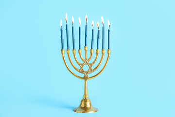 Menorah on blue background. Hanukkah celebration