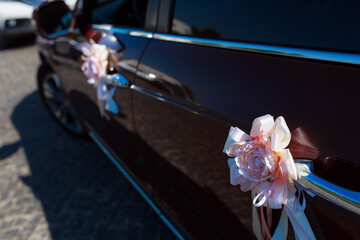 Wedding car. Red decoration. Can be used as background for design. Decor of the wedding car with...