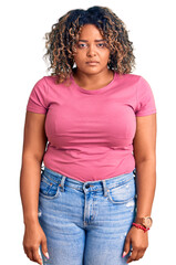 Young african american plus size woman wearing casual clothes looking sleepy and tired, exhausted...