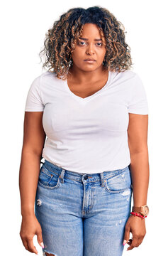 Young african american plus size woman wearing casual clothes depressed and worry for distress, crying angry and afraid. sad expression.