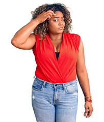 Young african american plus size woman wearing casual style with sleeveless shirt pointing unhappy to pimple on forehead, ugly infection of blackhead. acne and skin problem