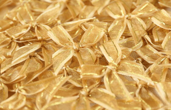 gold bows or ribbons background to congrate, celebrate,   pride, or festival use 