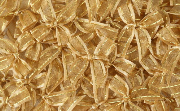 gold bows or ribbons background to congrate, celebrate,   pride, or festival use 