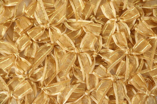 gold bows or ribbons background to congrate, celebrate,   pride, or festival use 