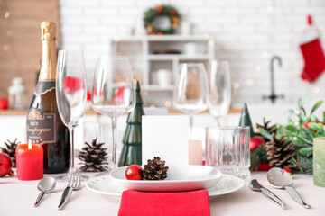 Festive table setting with Christmas decorations in kitchen, closeup