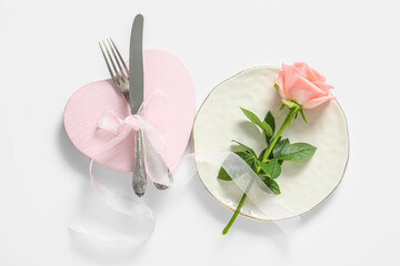 Beautiful table setting with rose for Valentine's Day on white background