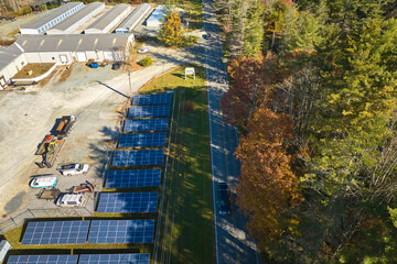 Aerial view of big sustainable electric power plant with many rows of solar photovoltaic panels for producing clean electrical energy. Renewable electricity with zero emission concept