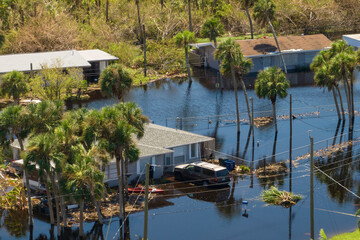 Fototapeta na wymiar Aftermath of natural disaster. Surrounded by hurricane rainfall flood waters homes in Florida residential area