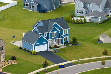 American dream homes as example of real estate development in US suburbs. View from above of residential houses in living area in Rochester, NY