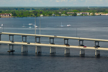 Barron Collier Bridge and Gilchrist Bridge in Florida with moving traffic. Transportation...