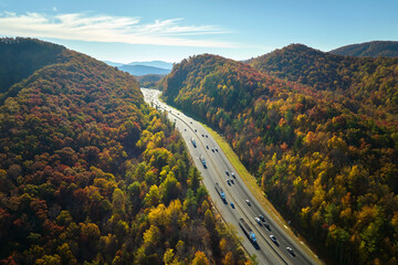I-40 freeway in North Carolina leading to Asheville through Appalachian mountains in golden fall...