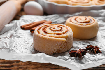 Uncooked cinnamon rolls on table