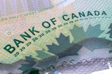 Closeup macro Bank of Canada words on a green 20 dollar Canadian money bill