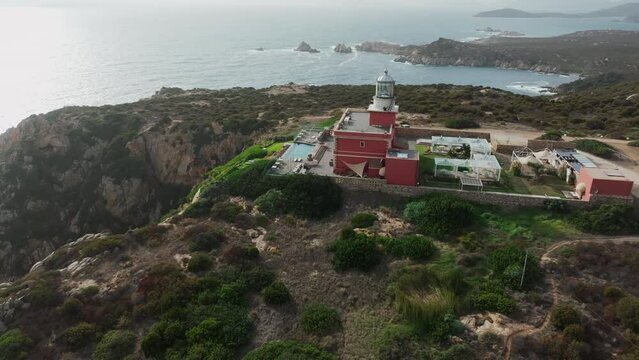 Faro di Capo Spartivento, Sardinia: wonderful lateral aerial view of the beautiful lighthouse.