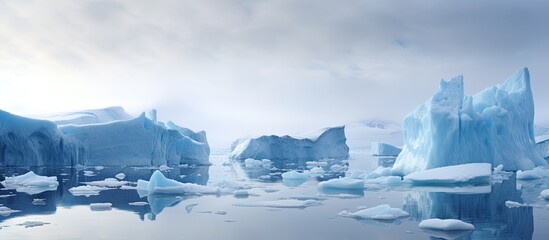 Fototapeta na wymiar Melting glacier causes fractured shelf ice in open water.