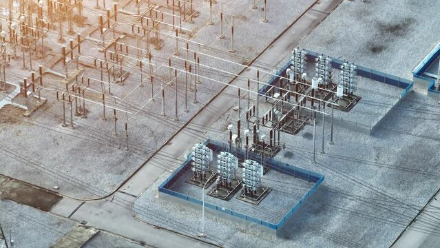 From high above, the electrical substation emerges, an imposing fortress of energy, casting shadows and sparking connections with its sprawling machinery.
