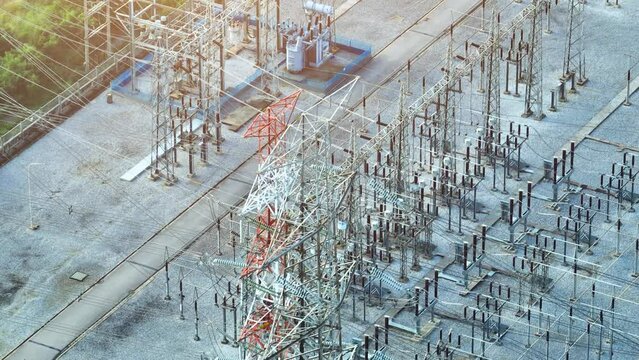 High voltage substations are critical components of electrical grids. They transform and distribute electricity at elevated voltages, ensuring efficient power transmission. Bird's eye view by drone.
