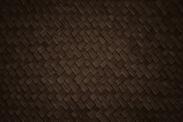 Pattern of dark brown weave reed mat with vintage style for background and design art work.