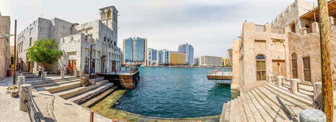 Cargo pier on Dubai Creek near reconstructed old part of Dubai city - Al-Bastakiya quarter in Dubai...