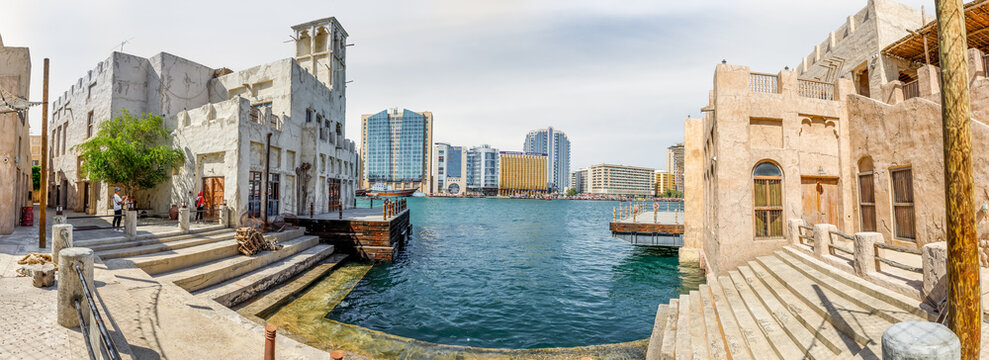 Cargo pier on Dubai Creek near reconstructed old part of Dubai city - Al-Bastakiya quarter in Dubai city, United Arab Emirates
