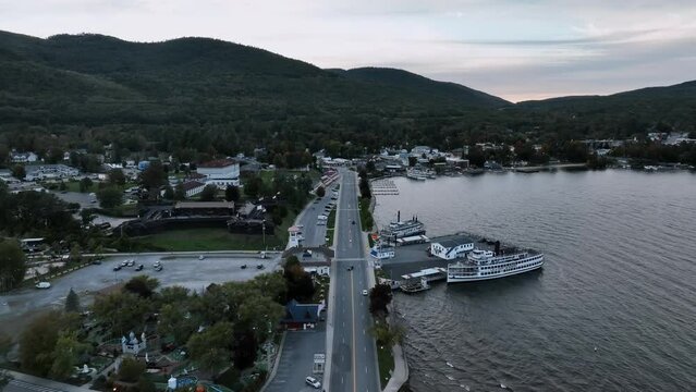 Lake George Town, Road and Cruise Line Port During Sunset In New York, USA. - aerial shot