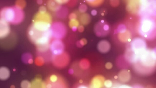 Colorful pink red gold bokeh festive animation background. Looping glowing blurry boke backdrops