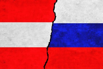 Russia and Austria painted flags on a wall with a crack. Russia and Austria relations. Austria and Russia flags together
