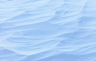 Natural winter texture of snowy crust on beach of frozen Baikal Lake in cold January day. Abstract...