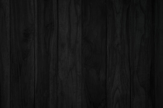 Black vintage painted wooden boards wall antique old style background. Grunge dark old wood texture and seamless for furniture design. Painted weathered peeling table wood hardwood decoration.
