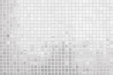 White tile wall chequered background bathroom texture. Ceramic brick wall and floor tiles mosaic...