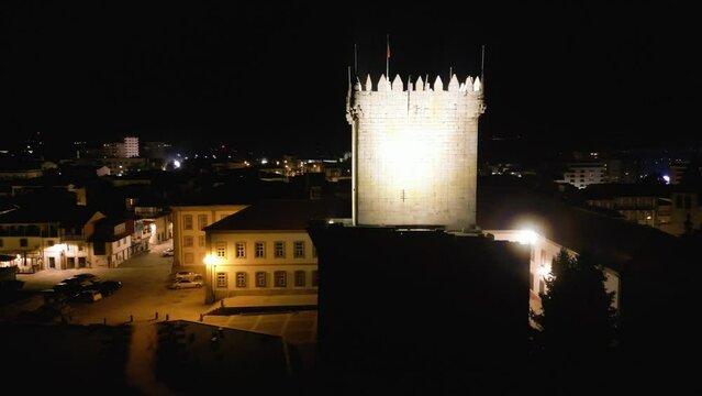 Drone push in to lit castle tower in Chaves Vila Real Portugal