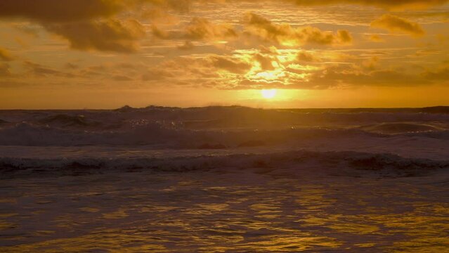 Stunning Sunset Beach. Slow Motion Waves Crashing Over Shore. 