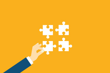 Teamwork. Putting a puzzle together