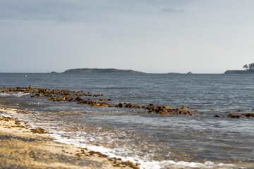 Fototapeta na wymiar flat rocky coastline by the ocean in tasmania australia