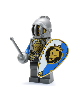 Lego minifigure of knight or gladiator with shield and sward. Editorial illustrative image of popular plastic toy constructor.