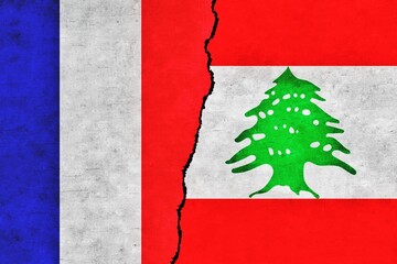 France and Lebanon painted flags on a wall with a crack. France and Lebanon relations. Lebanon and France flags together