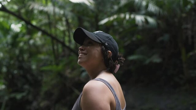 Slow motion shot of a woman smiling in a Puerto Rican Jungle