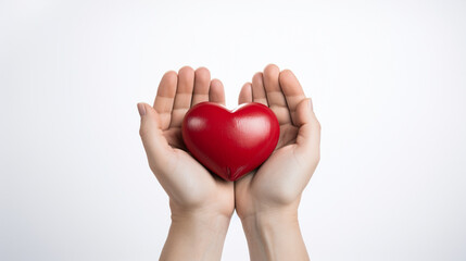 Heart in hands, white background, health and life insurance concept