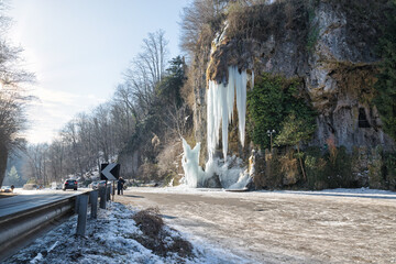 Wave of frost in north Italy. Frozen ice waterfall, winter landscape. Province of Varese, Valganna...