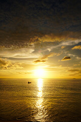 Scenic destination. A Kayak in a amazing golden sunset and clouds over the ocean. From a tropical island in the south of Thailand.