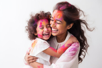 Indian ethnic mother and daughter having fun by celebrating Holi festival with colours
