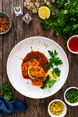 Roast chicken breast in bbq sauce on wooden table
