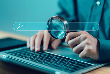 businessman using a laptop, show search bar. concept of a website to find a job and career on the...